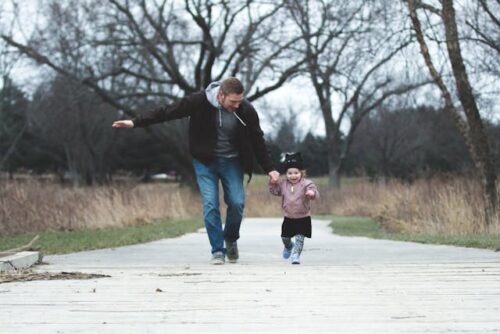 man walking with child