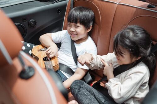 two kids in car