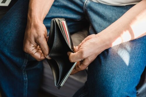 man with empty wallet