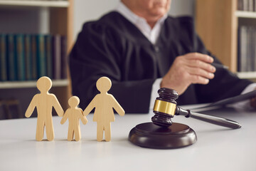judge with gavel and wooden family