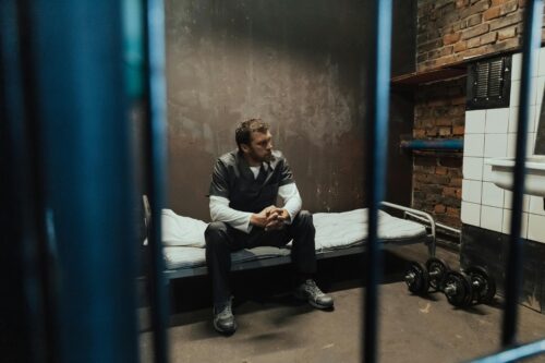 man in jail cell