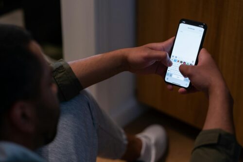 man on phone texts